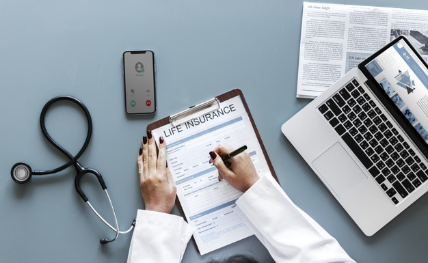 doctor filling up life insurance form 53876 20493